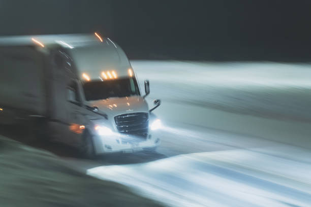 istock Semi Truck on Highway in Winter 1365180027