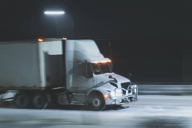 istock Semi Truck on Highway in Winter 1365180028