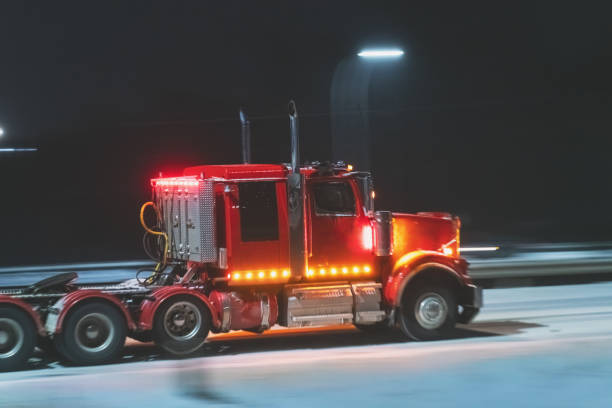 istock Semi Truck on Highway in Winter 1365180042