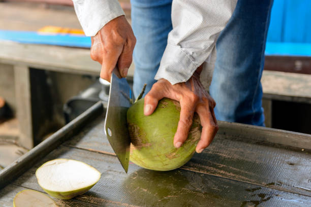 istock person slicing an coconut 1365180663
