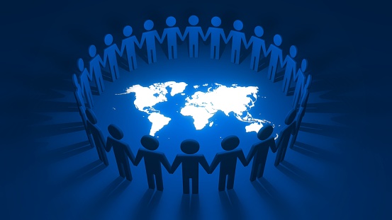 Group of cutout people holding hands together forming a connected circle of alliance and cooperation around white world map on blue background. 3D illustration concept of community and togetherness.