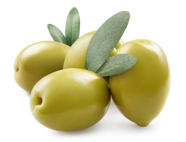 istock Delicious green olives with small olive leaves on white 1365191654