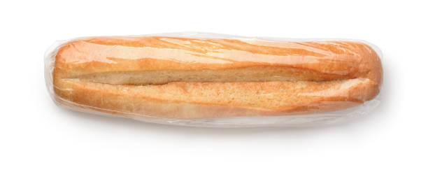 вид сверху свежей булочки в полиэтиленовом пакете - baguette french culture bun bread стоковые фото и изображения