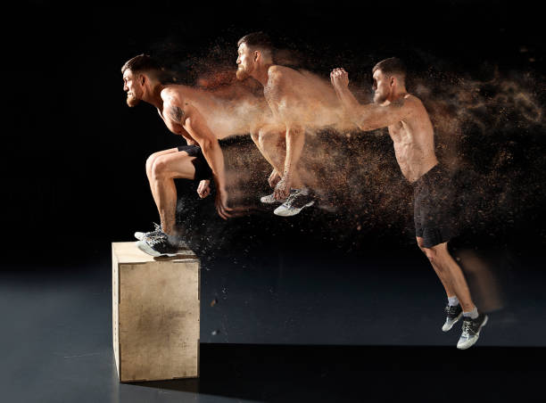 istock Man jumping on fit box in gym 1365193042