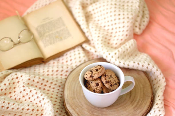 istock Mug with Cookies, Book and Glasses 1365194679