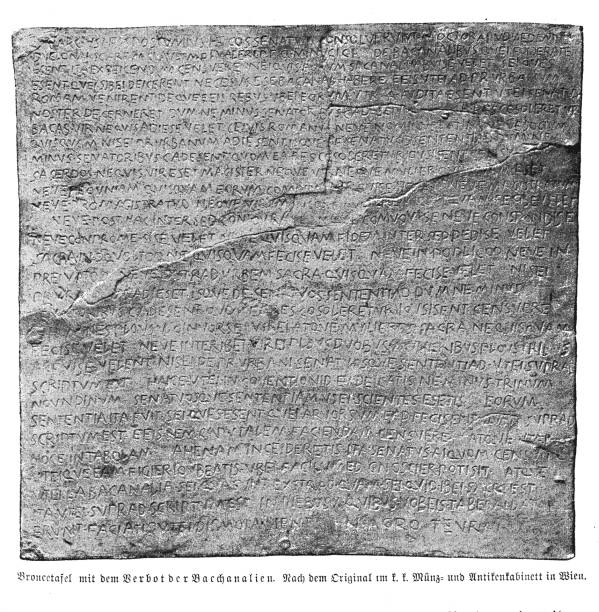 istock Bronze plate with an old Latin inscription dated 186 BC about the official suppression of Bacchanalia, Roman festivals of Bacchus cult 1365194719
