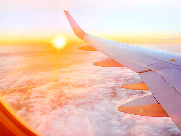 istock Airplane wing in the sky at beautiful sunset 1365196543