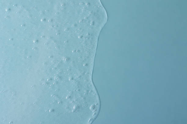 istock Background from cosmetic gel with bubbles,dripping down.Top view,antibacterial liquid surface.Good as background or mockup. 1365198207