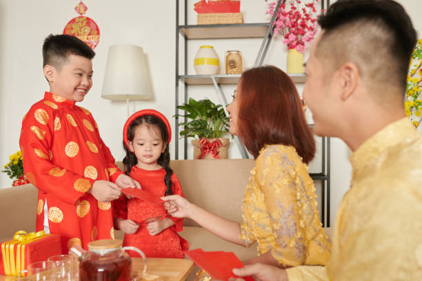 istock Parents Giving Envelopes to Kids 1365198843