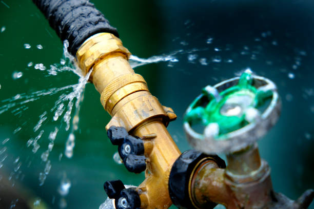 Closeup of leaky faucet spraying water leak drops drips