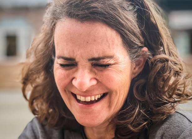 istock Mature woman laughing close up 1365200965