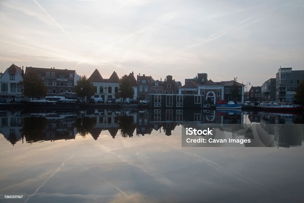 Dawn over Spaarne river in the city centre of Haarlem Dawn over Spaarne river in the city centre of Haarlem in Haarlem, North Holland, Netherlands Architecture Stock Photo