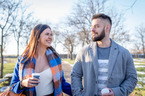 istock Young couple in a park 1365203127