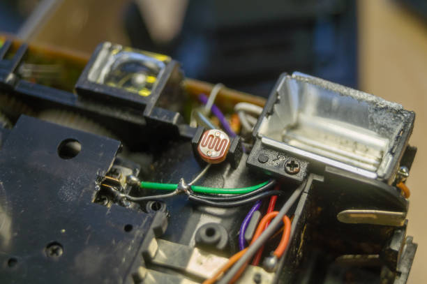 istock Disassembled compact camera. Internal parts of the broken camera being repaired in the workshop. Selective focus 1365204403