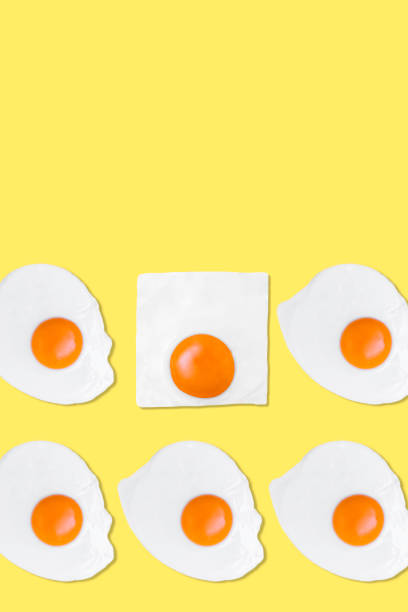 istock Creative photos of a fried chicken egg on a yellow background 1365206060