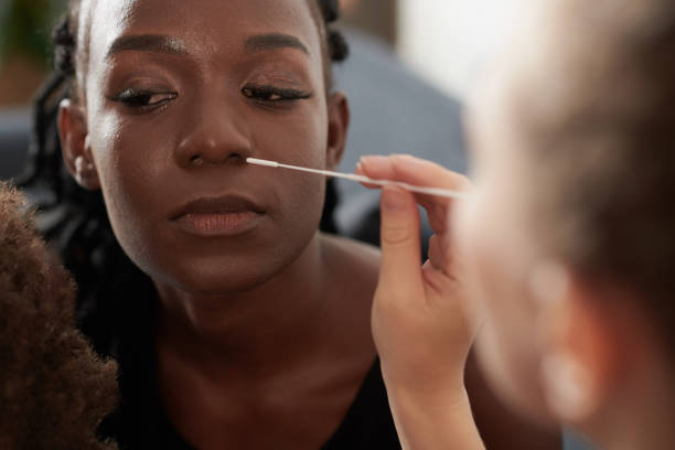 istock Woman Taking Covid-19 Test at Home 1365207192
