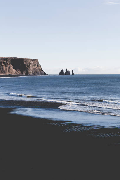 istock rynisfjara black sand beach, iceland 1365207571