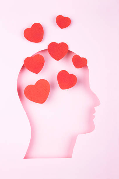 Human head in paper cut style and hearts