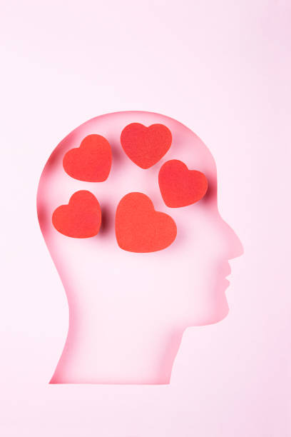 istock Human head in paper cut style and hearts 1365210859