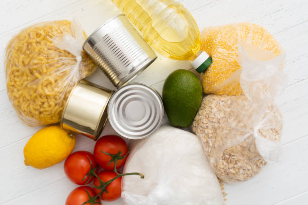 istock Food donations on wooden background, top view with copy space 1365217287