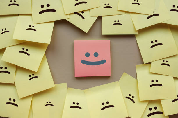 istock Standing Out From The Crowd With Smiling Hexagon 1365217875