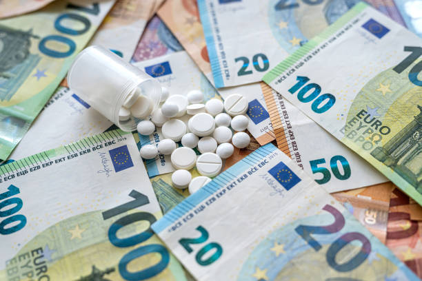 Medical tablets on euro banknote as background, Health care business, high cost