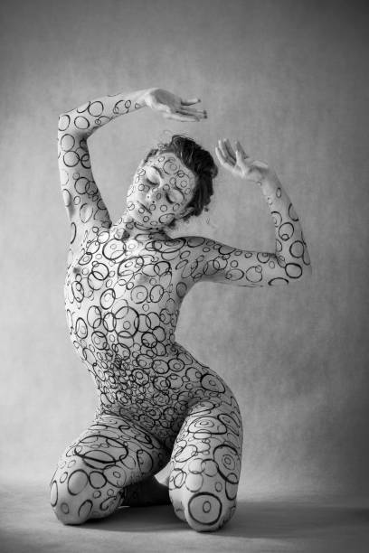 Close-up shot of a body painting process.
