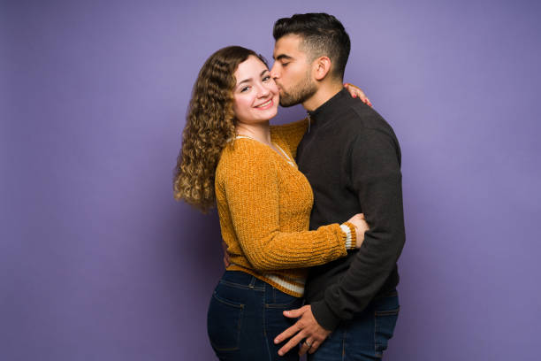 istock Passionate man kissing his girlfriend 1365222994