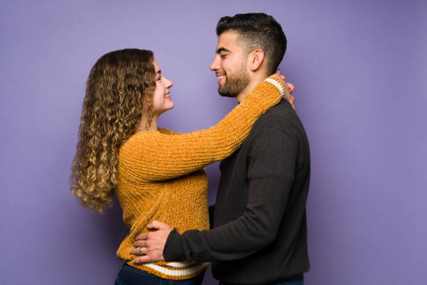 istock Loving woman hugging her boyfriend 1365223109