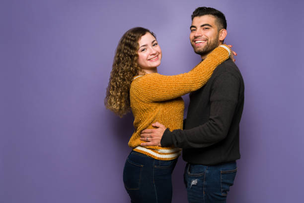 istock Happy boyfriend and girlfriend hugging 1365223158