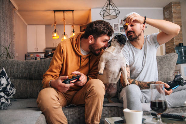 istock Excited friends playing video games 1365223214