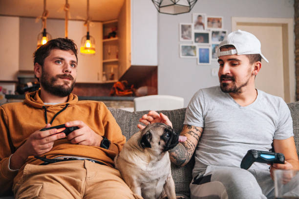 istock Excited friends playing video games 1365223215