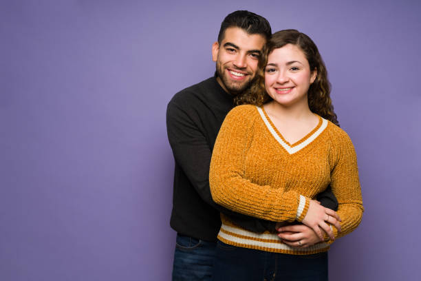 istock Happy boyfriend and girlfriend embracing 1365223322