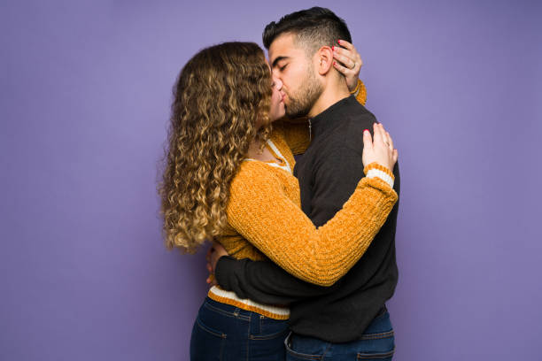 istock Romantic boyfriend and girlfriend kissing 1365224392