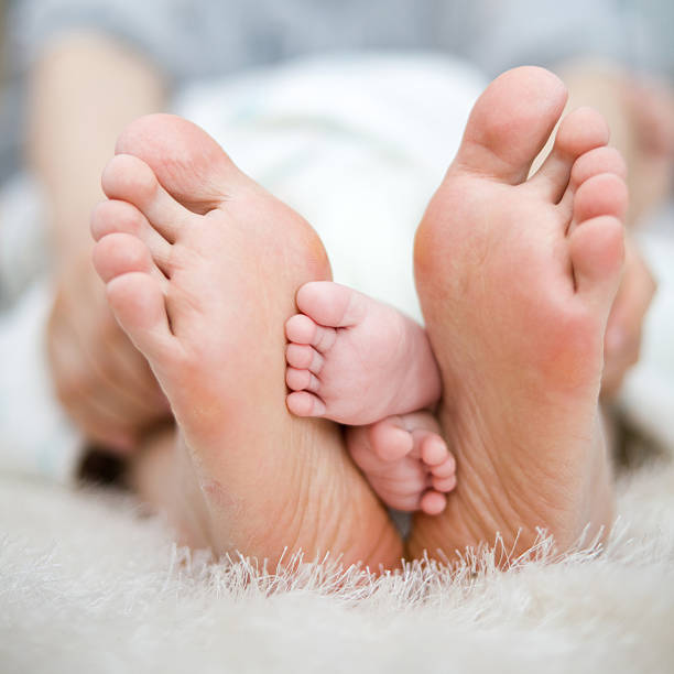 istock mother and baby's foot 136522450