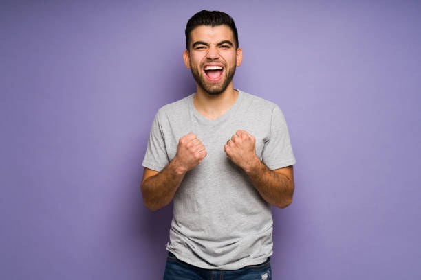 Super happy man with a lot of success stock photo