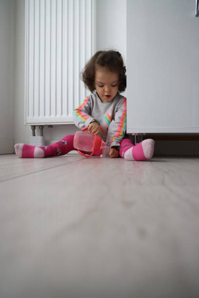 istock Little girl on the floor 1365225764