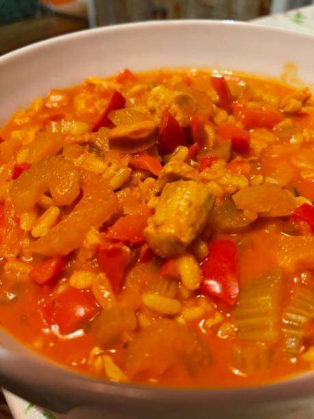 istock Winter stew with peppers, celery, tomatoes, onions, spring wheat, sausages, close-up 1365226778