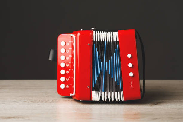 istock red bayan toy accordion on gray background 1365227423