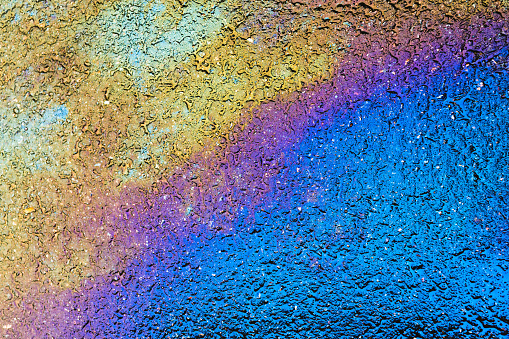 petrol spill rainbow background with copy-space