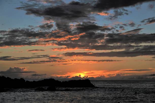 istock Golden orange beach sunset in Hawaii 1365229146
