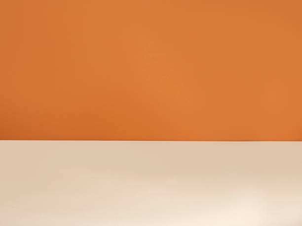 Orange and sand colors paper background stock photo