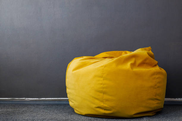 Ottoman or bag chair in the room. Background with copy space for text