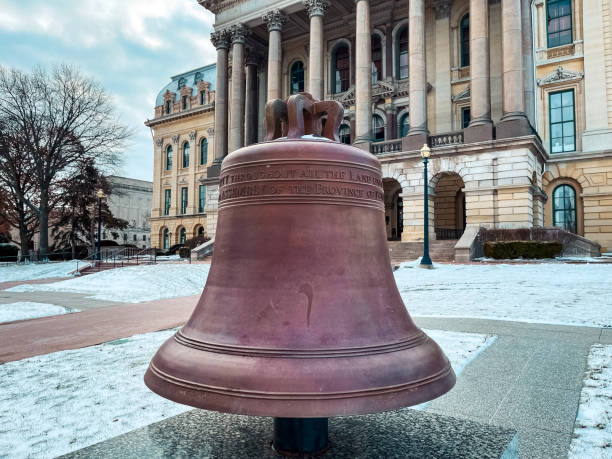 Liberty Bell in front of the Illinois State Capitol Building in Springfield, Illinois, USA Let freedom ring bronze Liberty Bell situated directly in from of the Illinois State Capitol Building. Taken during winter after fresh snowfall. springfield illinois stock pictures, royalty-free photos & images
