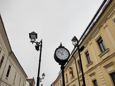 clock and buildings in Baia Mare city, Romania