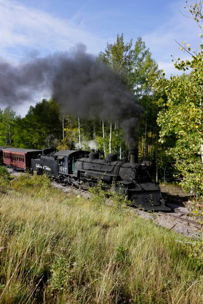 Chama, New Mexico, USA September 28, 2021: Cumbres and Toltec Scenic Railroad with smoke billowing from the steam engine stock photo