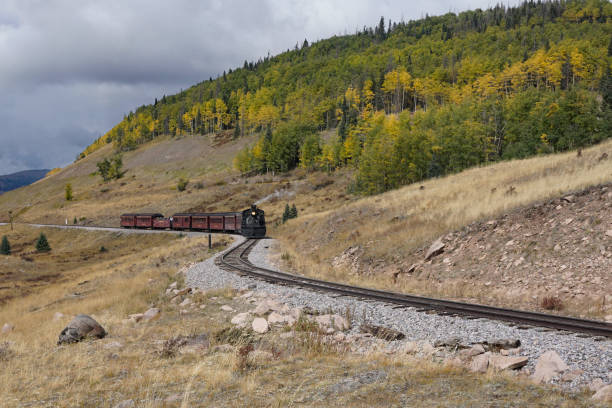 Photo of Chama, New Mexico, USA September 28, 2021: Cumbres and Toltec Scenic Railroad winding along the tracks