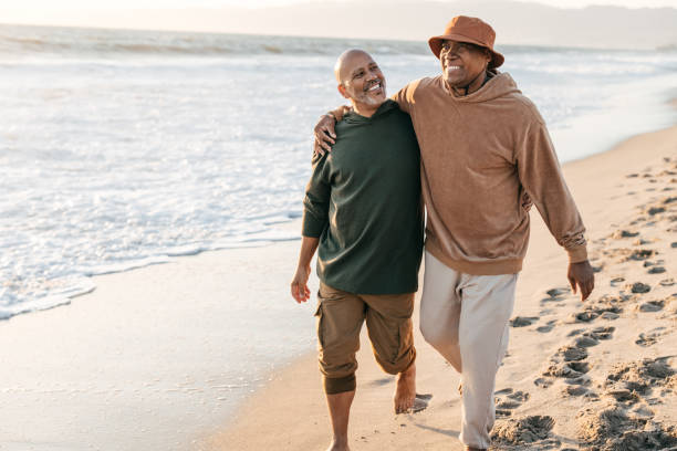 istock Senior  gay couple  on the beach 1365232009
