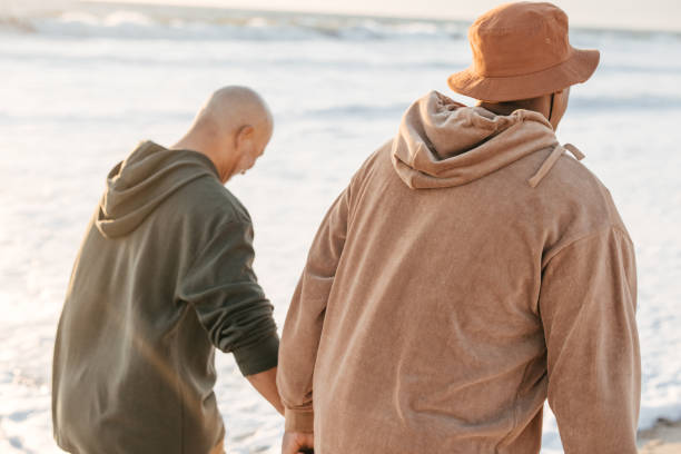 Senior couple walking on a beach together