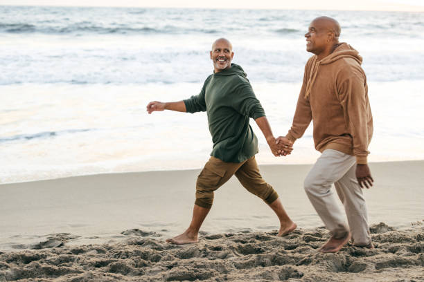 istock Senior  gay couple  on the beach 1365232032